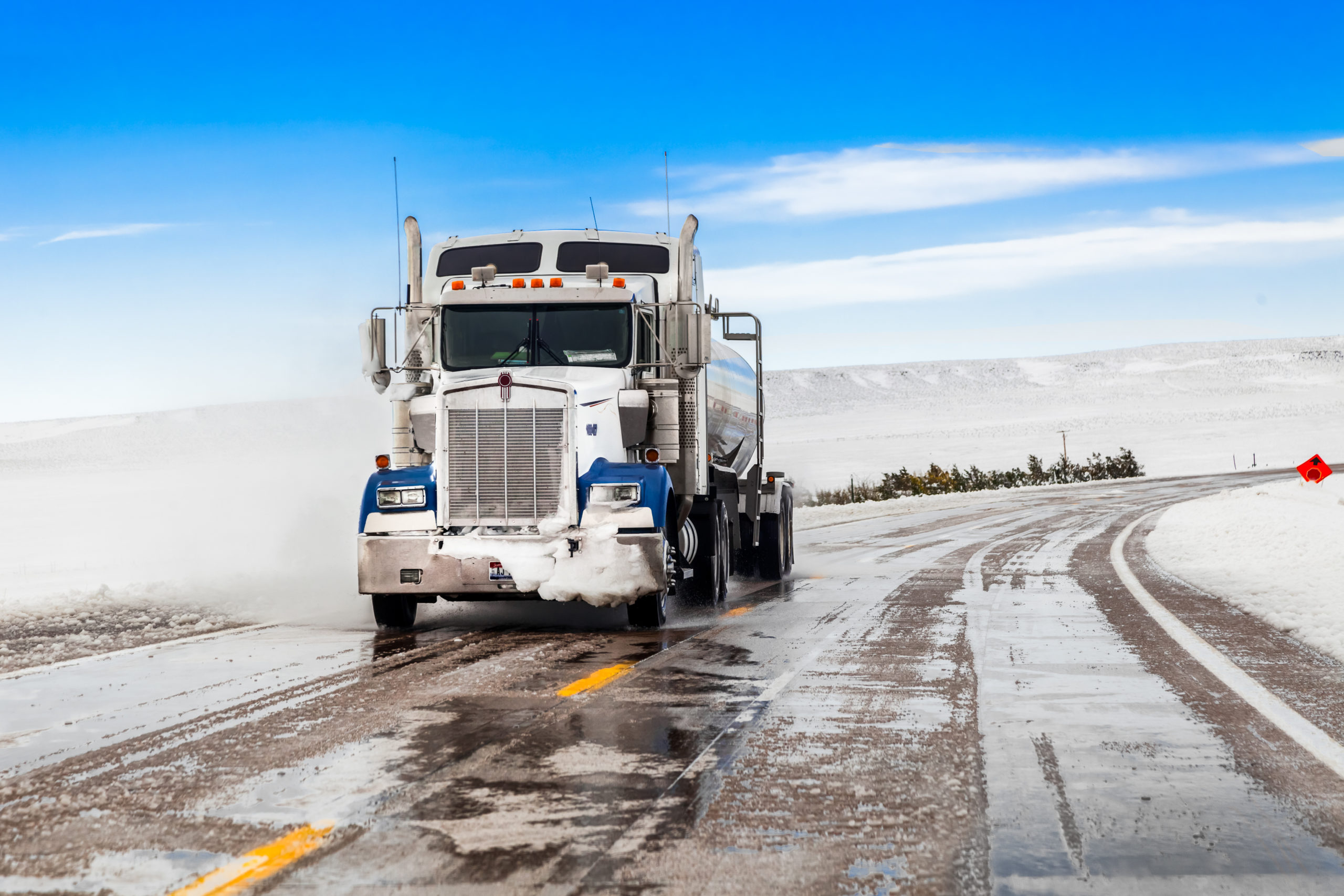 Semi Truck Driving On Snowy Conditions