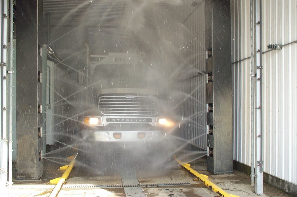 agriculture truck being washed in a biosecurity automated truck wash system