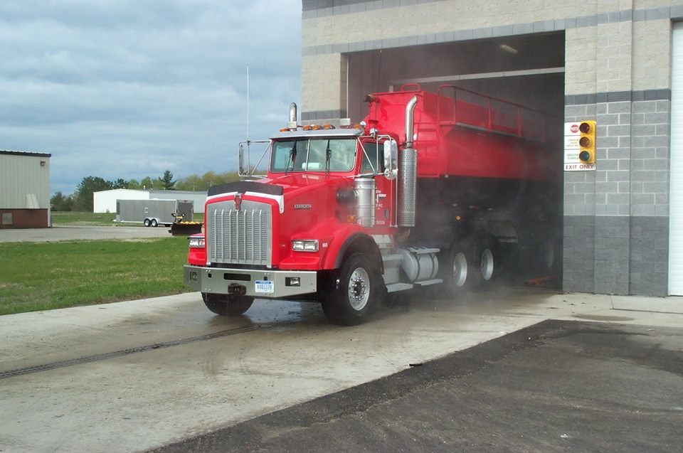 cleaned commercial truck with red tanker leaving hydro-chem systems, inc. automated truck wash