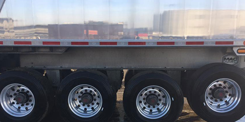 Photo of truck's trailer looking shiny and new after washing with supersonic