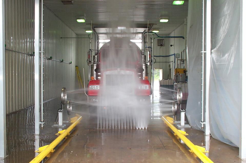 undercarriage of a truck washed by automated truck wash variable spray