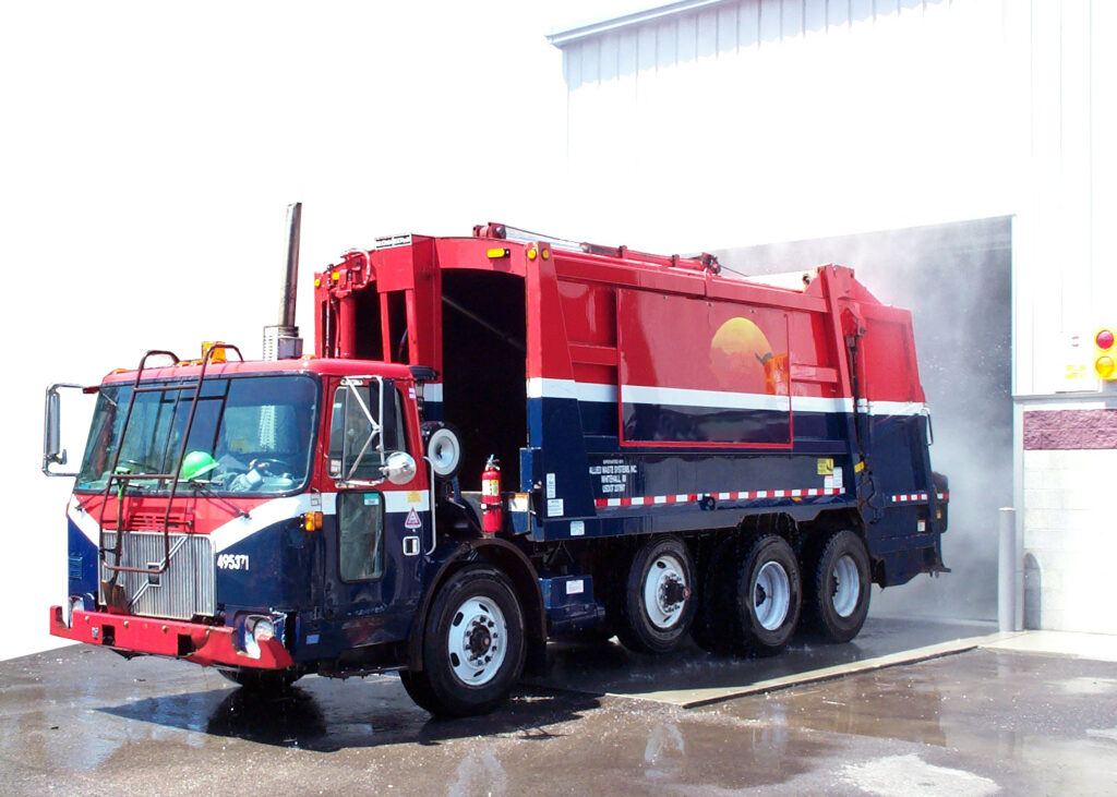 municipal garbage truck clean after going through automated truck wash