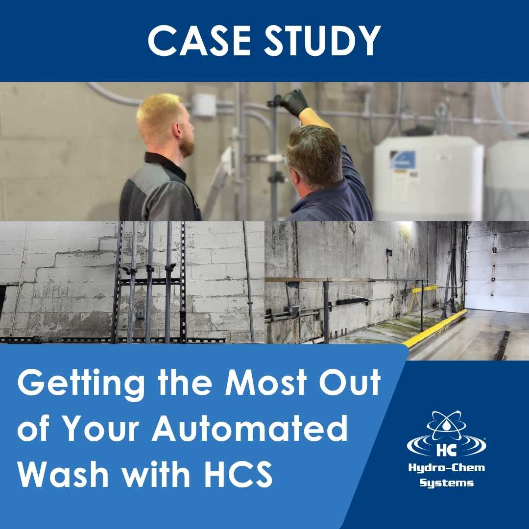 Technicians looking over machinery for an automated wash system